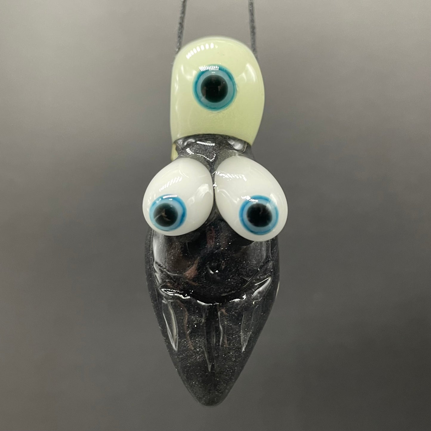 Black light reactive fertility pendant