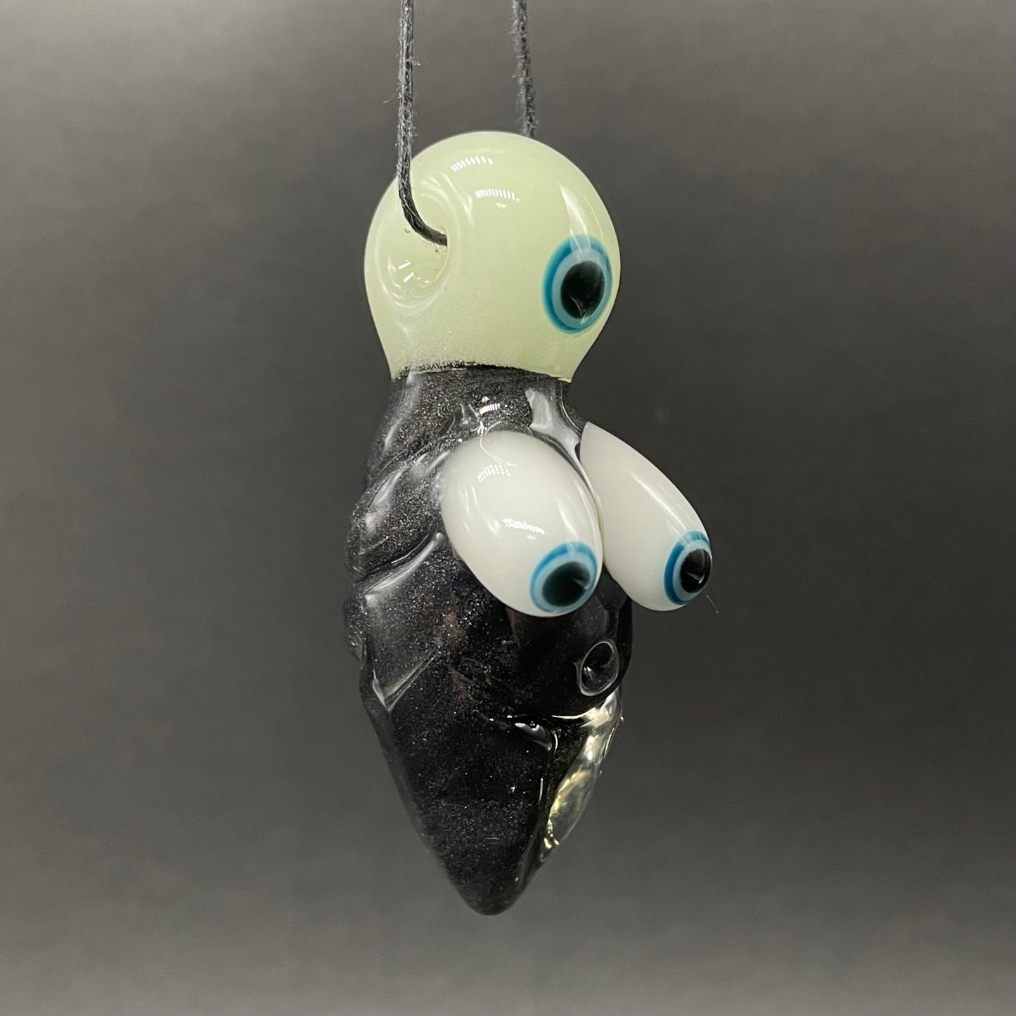 Black light reactive fertility pendant