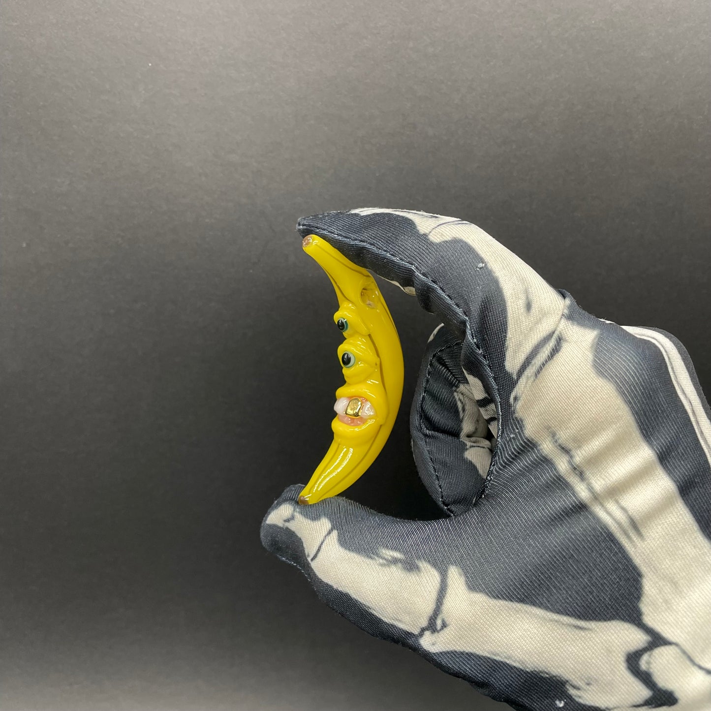 Grinning glass banana pendant