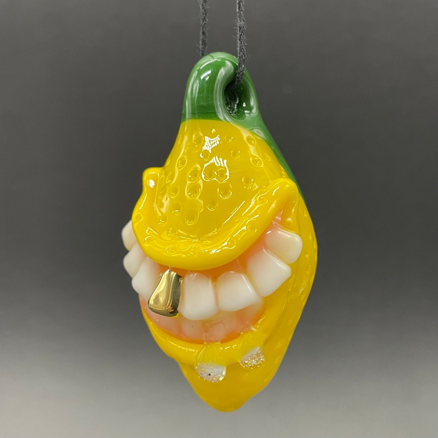 Grinning lemon pendant