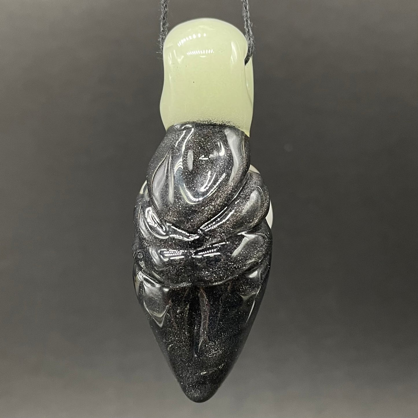 Black light reactive fertility pendant