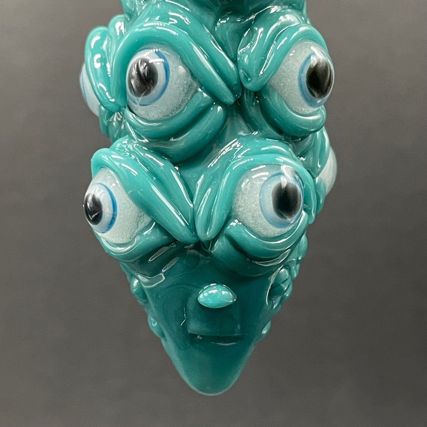 The Never-Blinking One glass effigy pendant