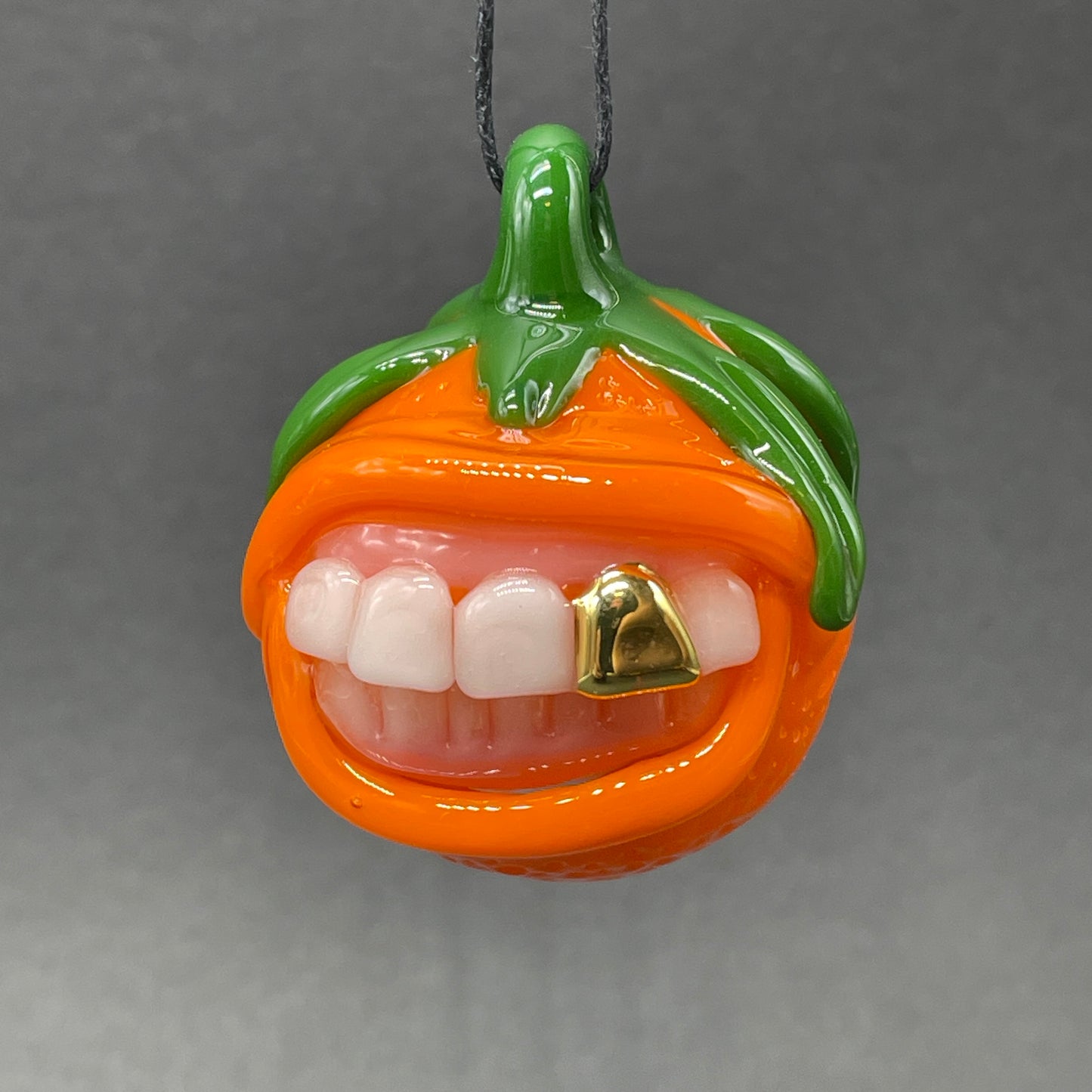 Toothy orange pendant