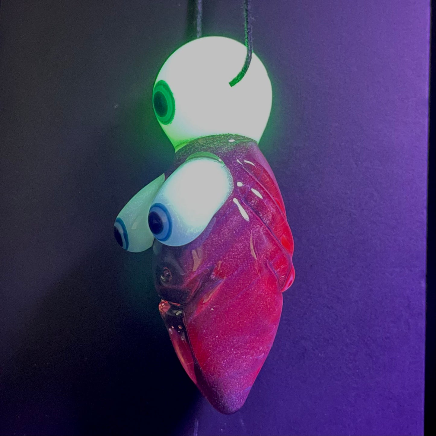 Black light reactive fertility pendant
