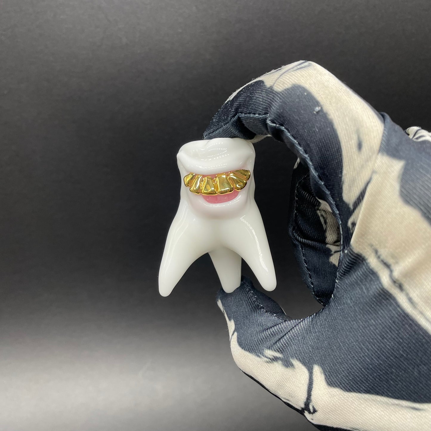 Tooth ache glass pendant