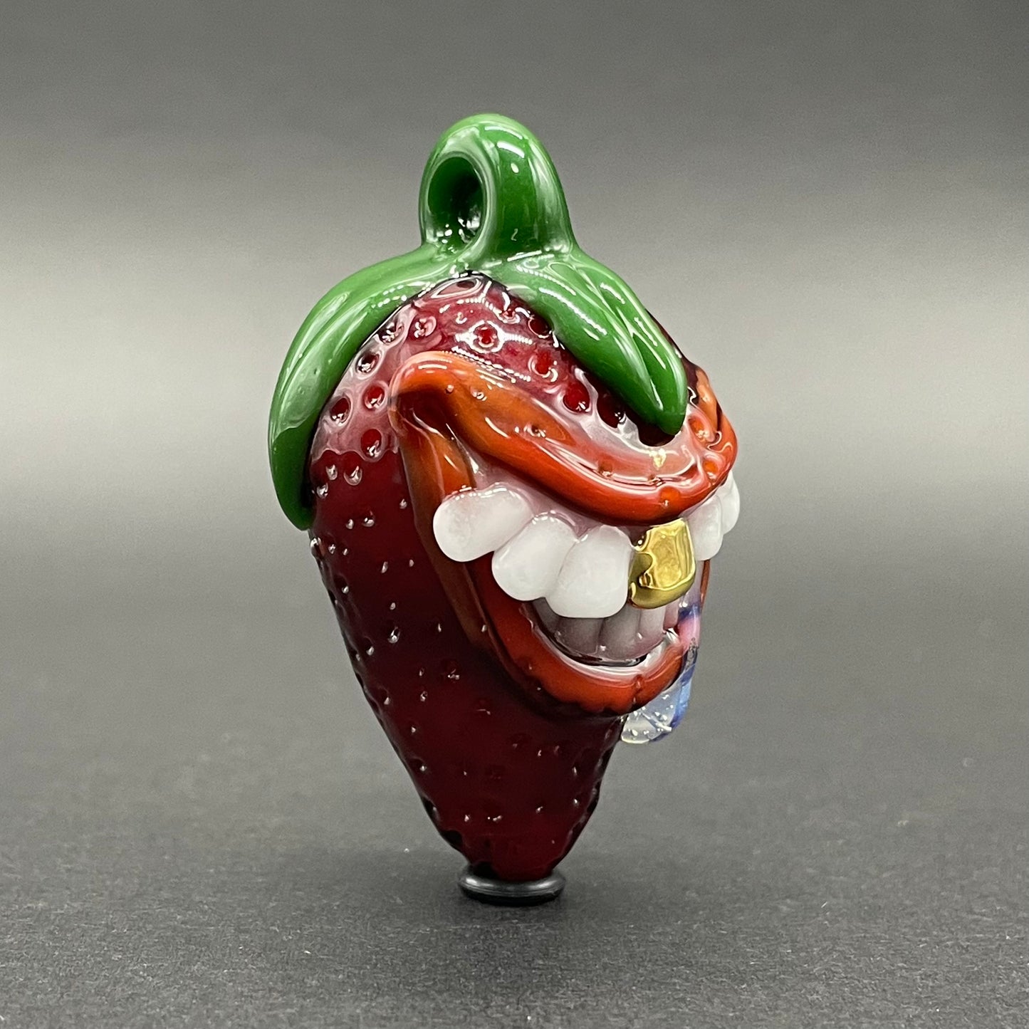 Toothy strawberry pendant