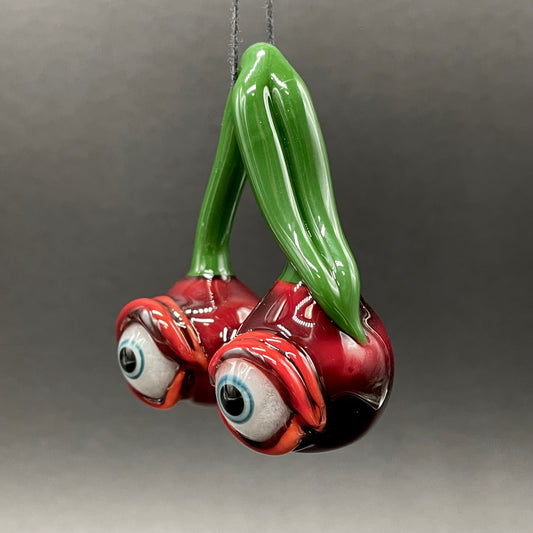 Cherry flavored glass eye pendant