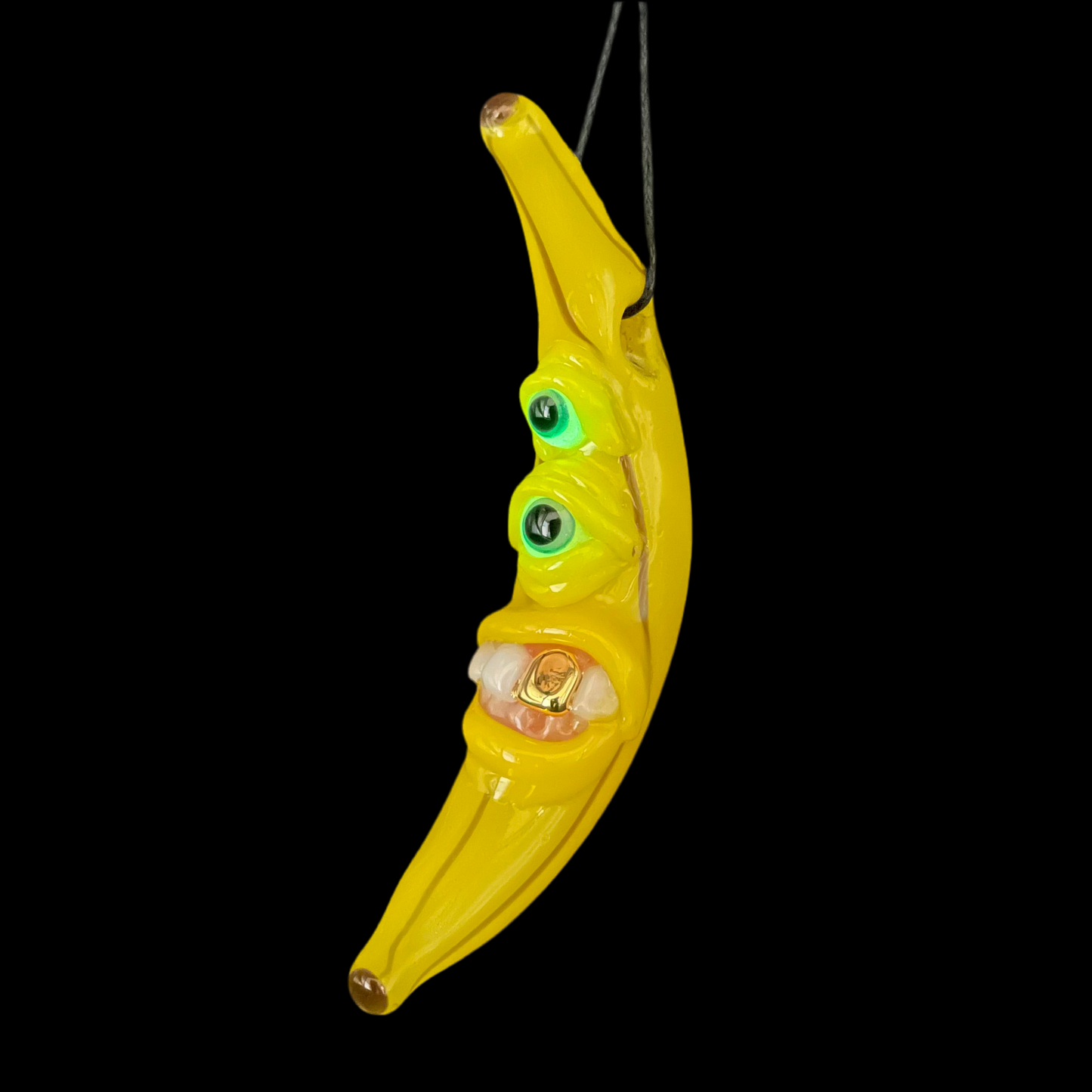 Grinning glass banana pendant