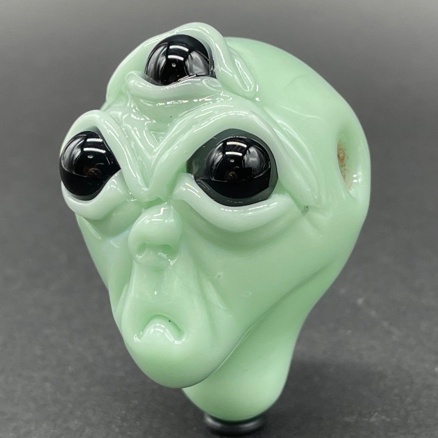 Time manipulating three eye glass alien pendant