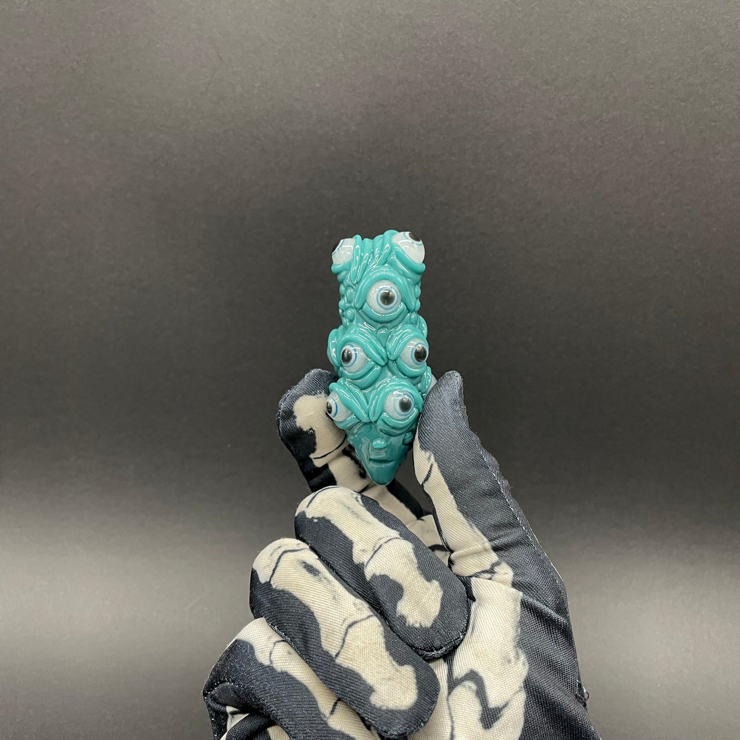 The Never-Blinking One glass effigy pendant