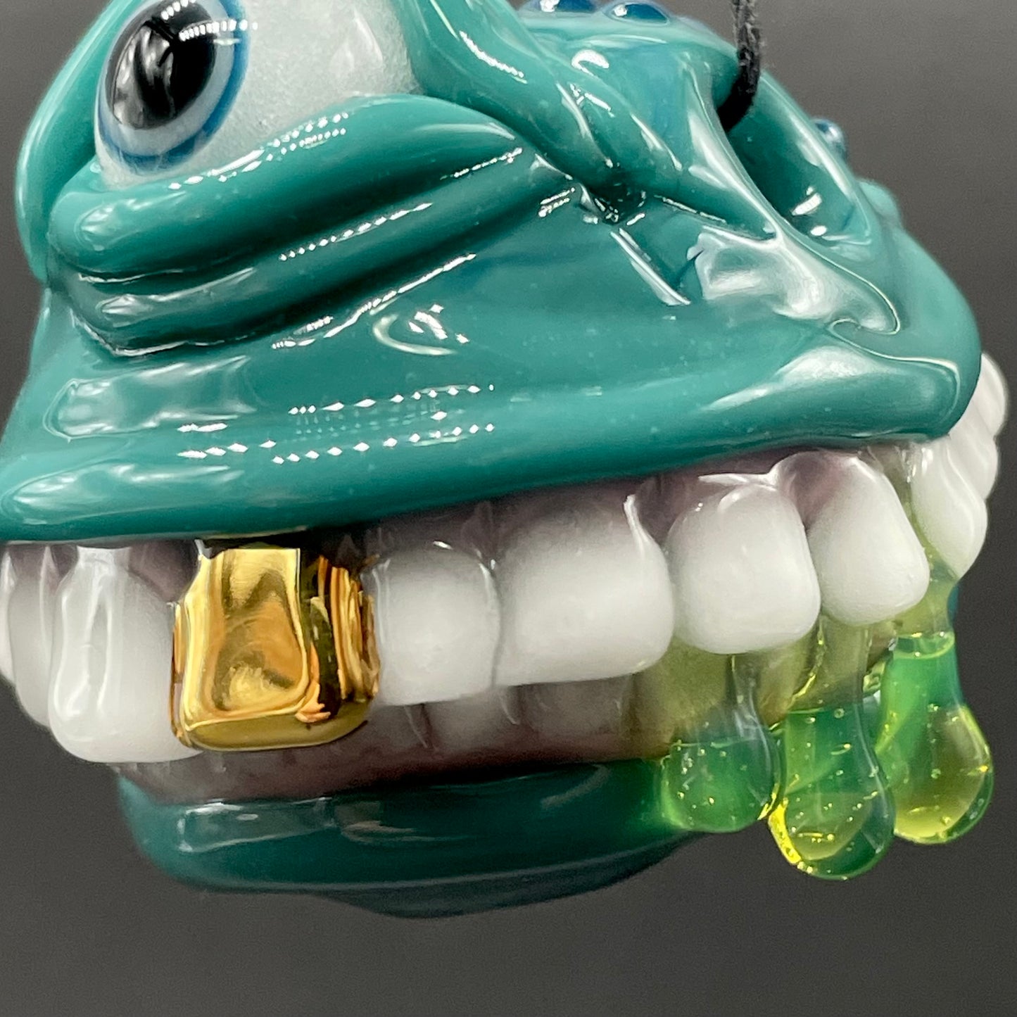 Grinning like a fool glass pendant