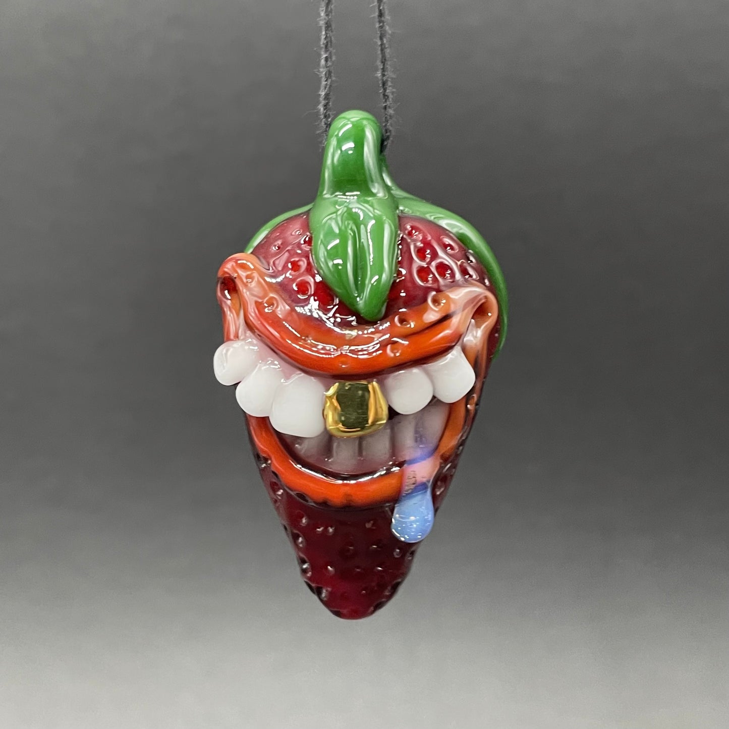 Toothy strawberry pendant