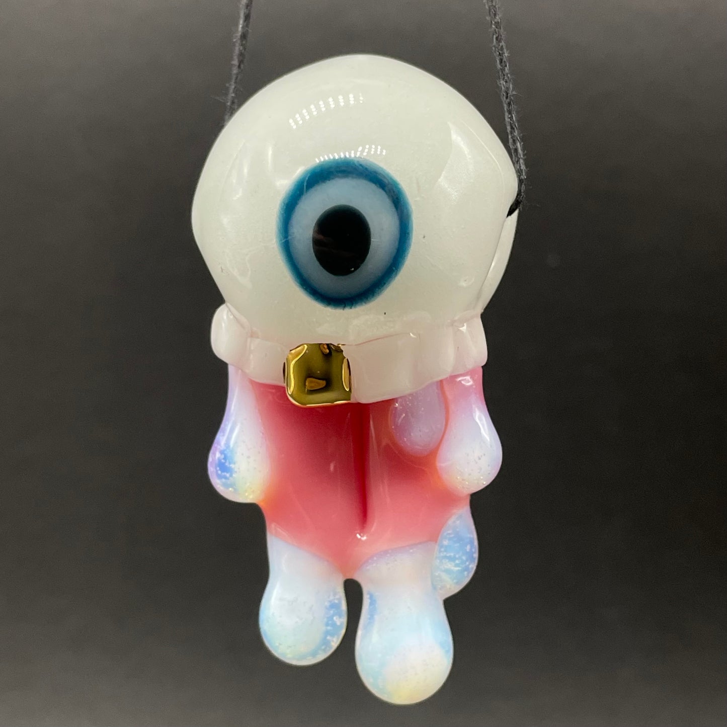 Glow in the dark eye pendant