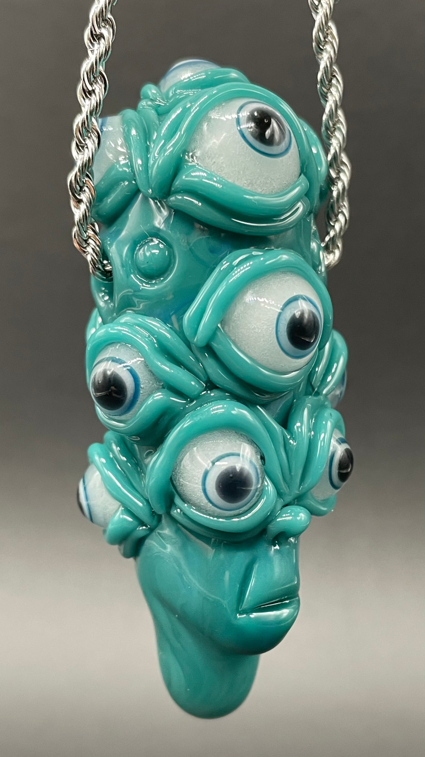 The Never-Blinking One glass effigy pendant
