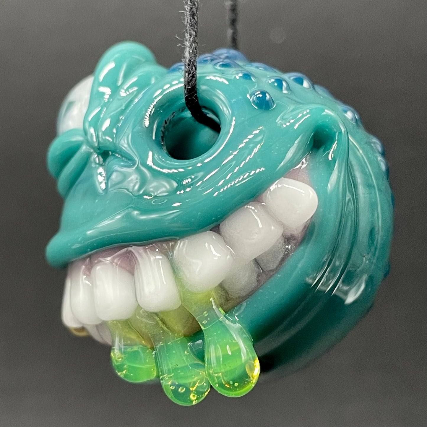 Grinning like a fool glass pendant