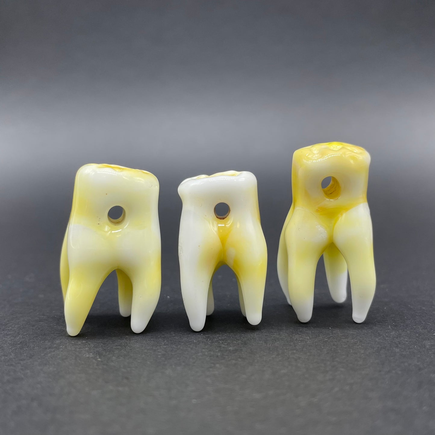 3 glass tooth beads