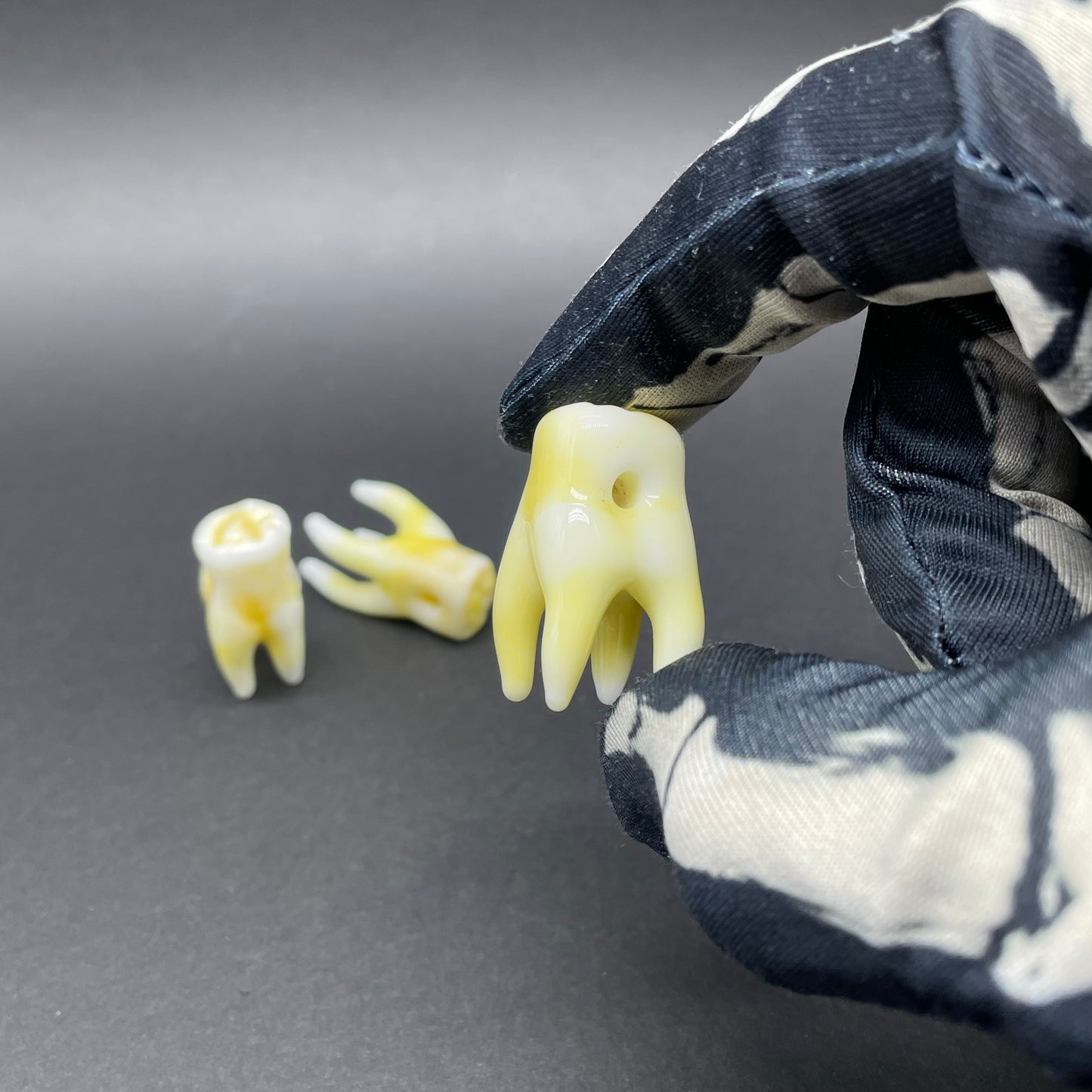3 glass tooth beads