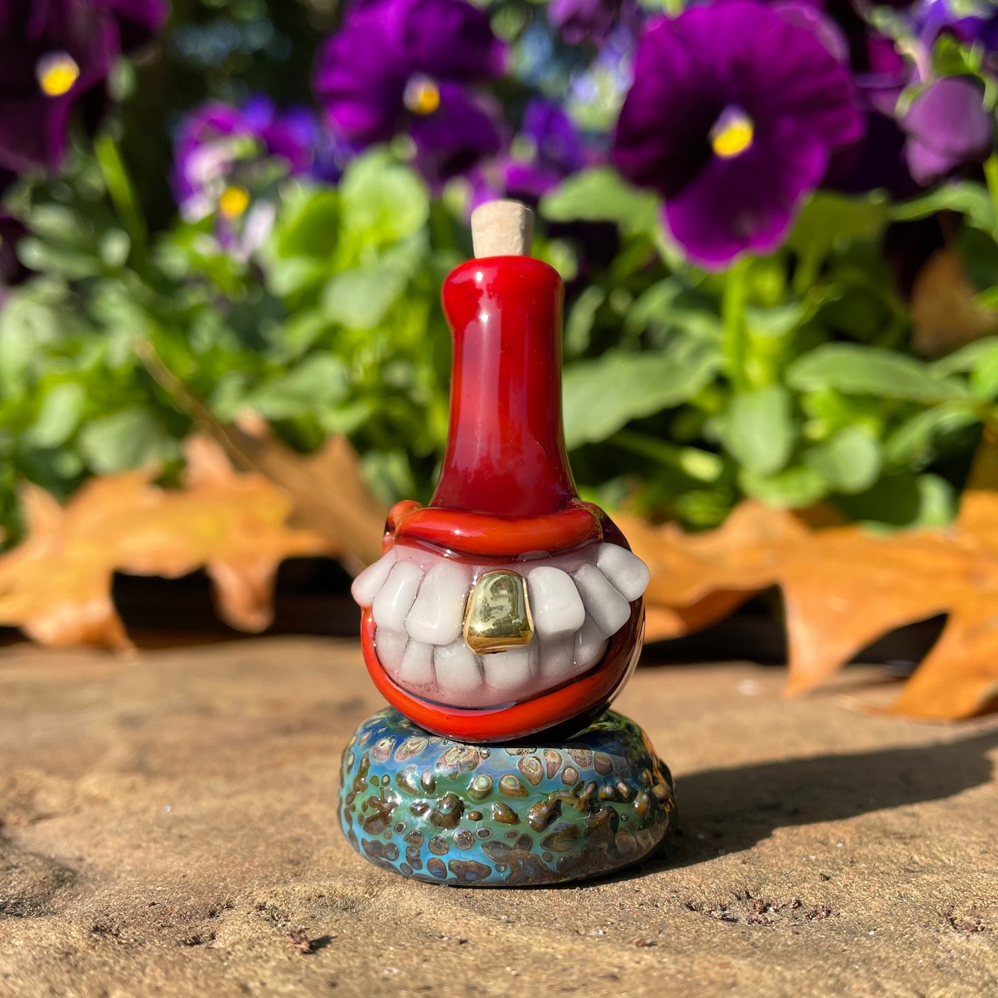 Red grinning glass cork bottle