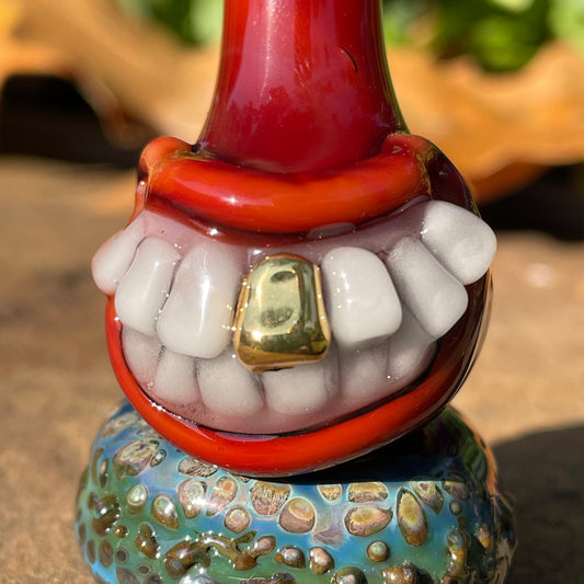 Red grinning glass cork bottle