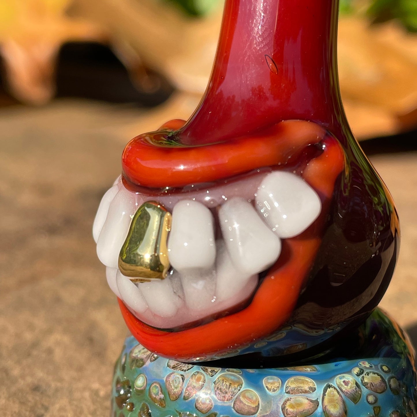 Red grinning glass cork bottle