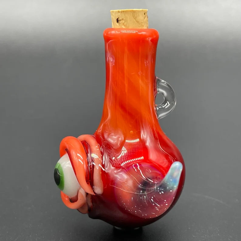 Red over white cyclops potion bottle