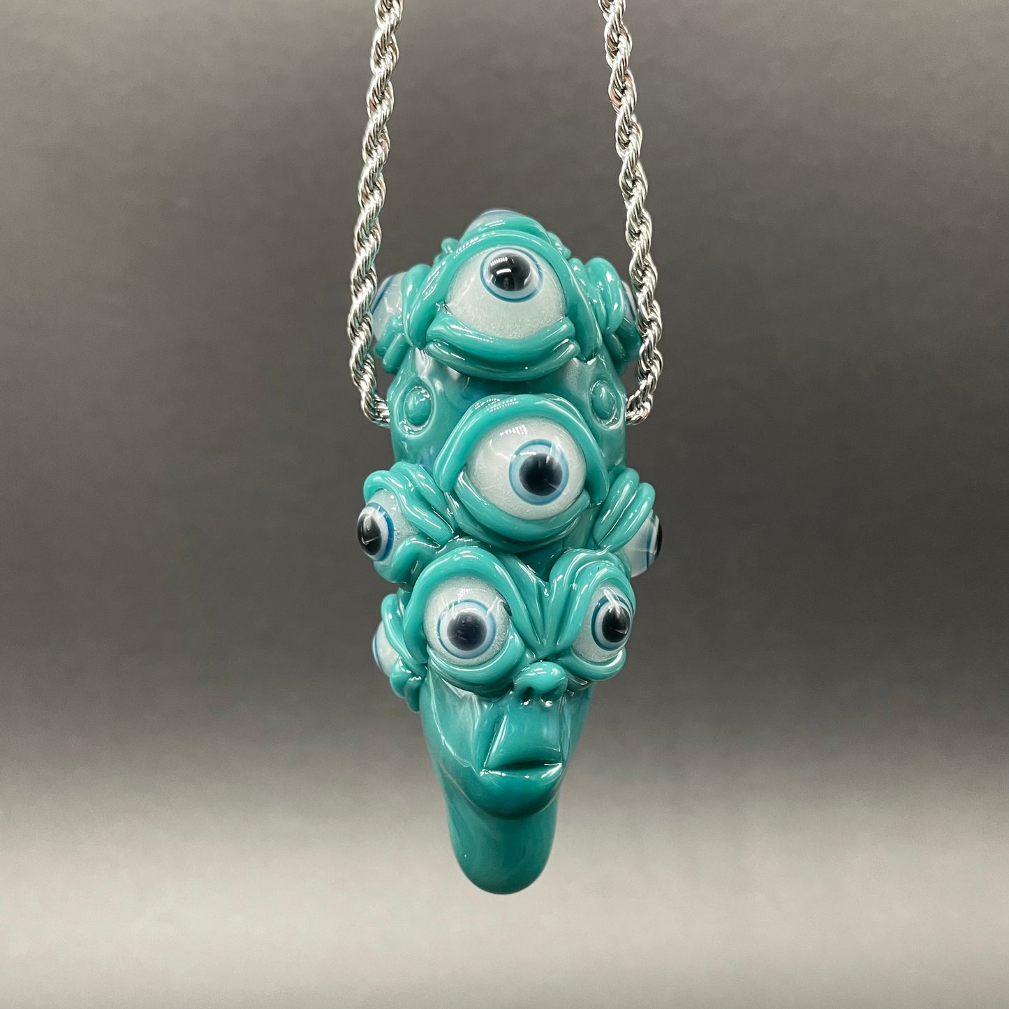 The Never-Blinking One glass effigy pendant