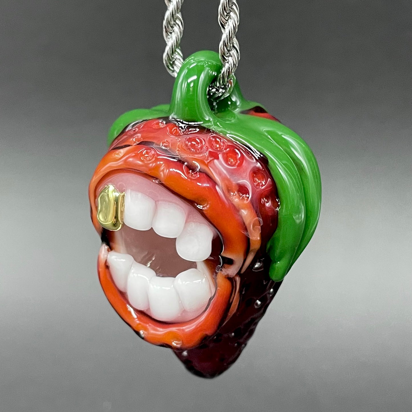 Screaming strawberry glass pendant