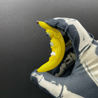 Grinning glass banana pendant