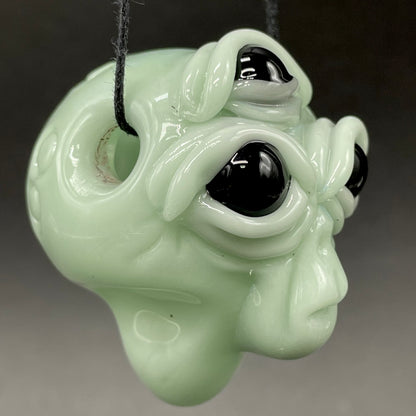 Time manipulating three eye glass alien pendant