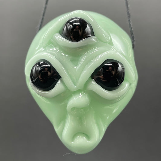 Time manipulating three eye glass alien pendant