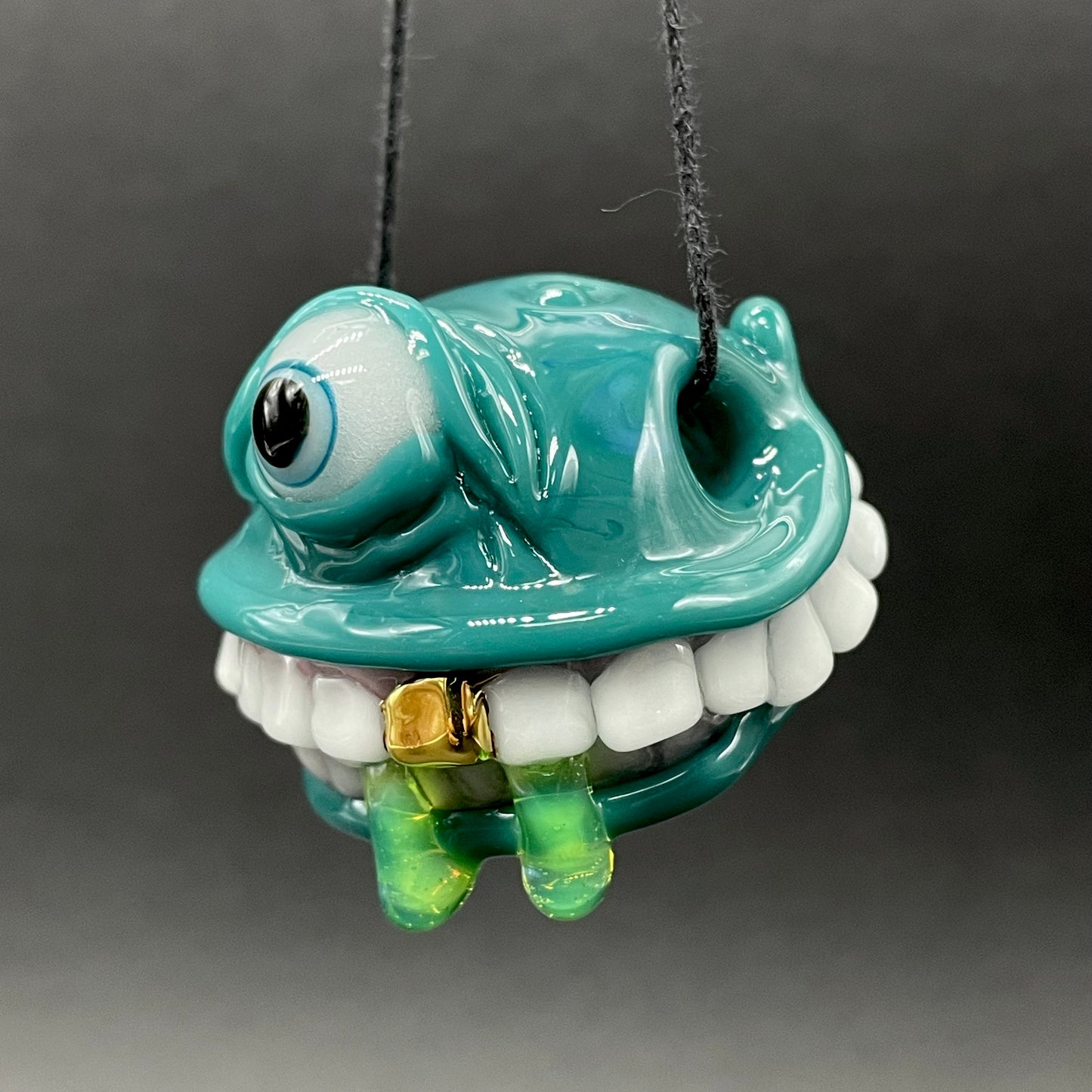 Grinning like a fool glass pendant