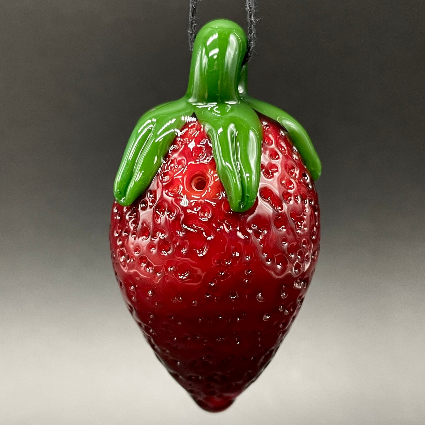 Toothy strawberry pendant