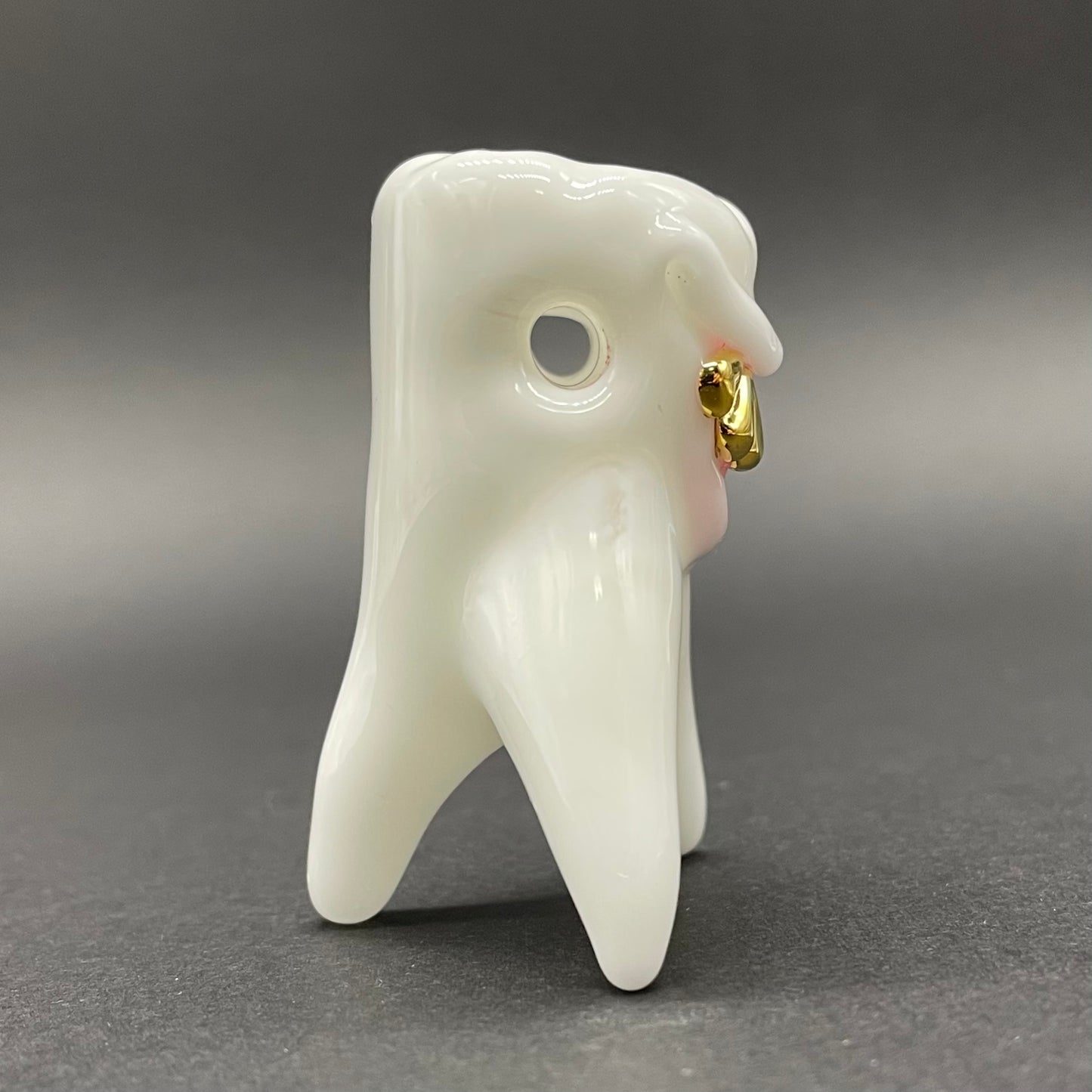 Tooth ache glass pendant
