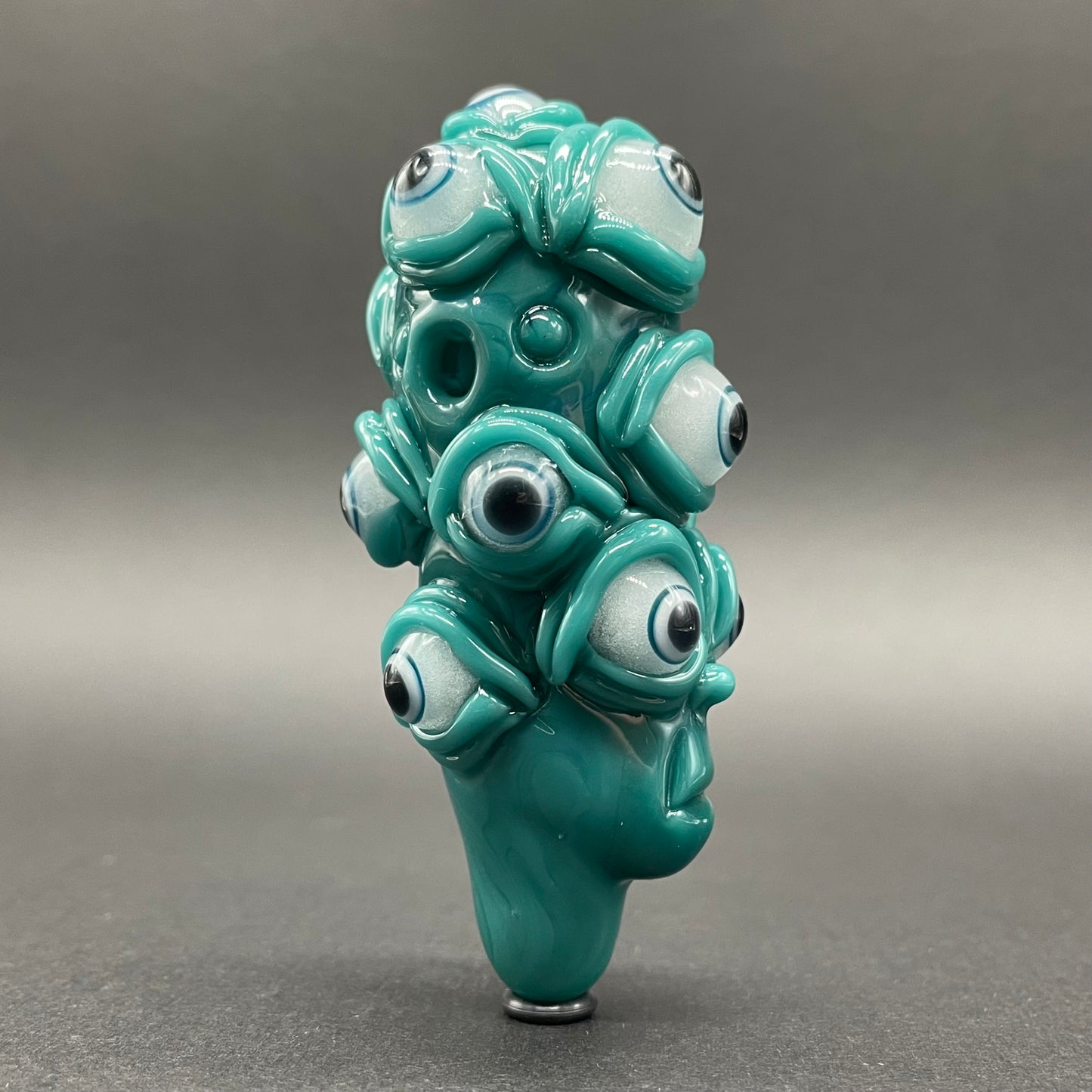 The Never-Blinking One glass effigy pendant