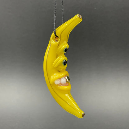 Grinning glass banana pendant