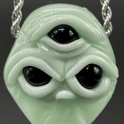 Time manipulating three eye glass alien pendant