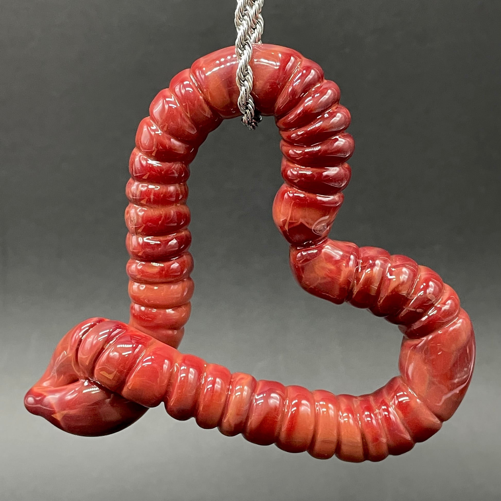 Large glass earthworm heart shaped pendant craftsmanship - artisan glass work