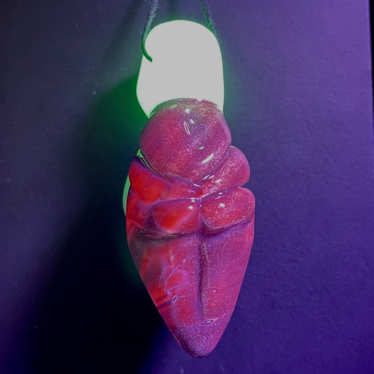 Black light reactive fertility pendant