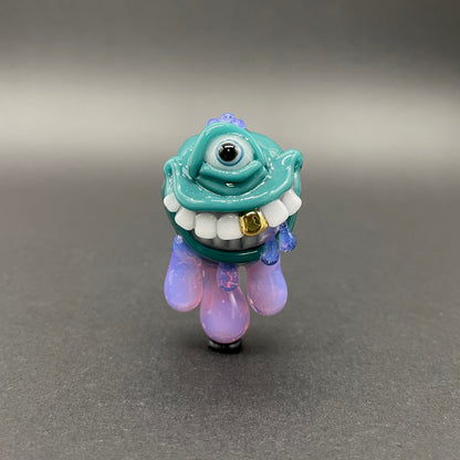 Dripping with sarcasm - Agua azule Drippy, grinning pendant