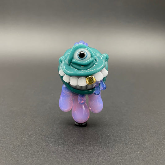 Dripping with sarcasm - Agua azule Drippy, grinning pendant