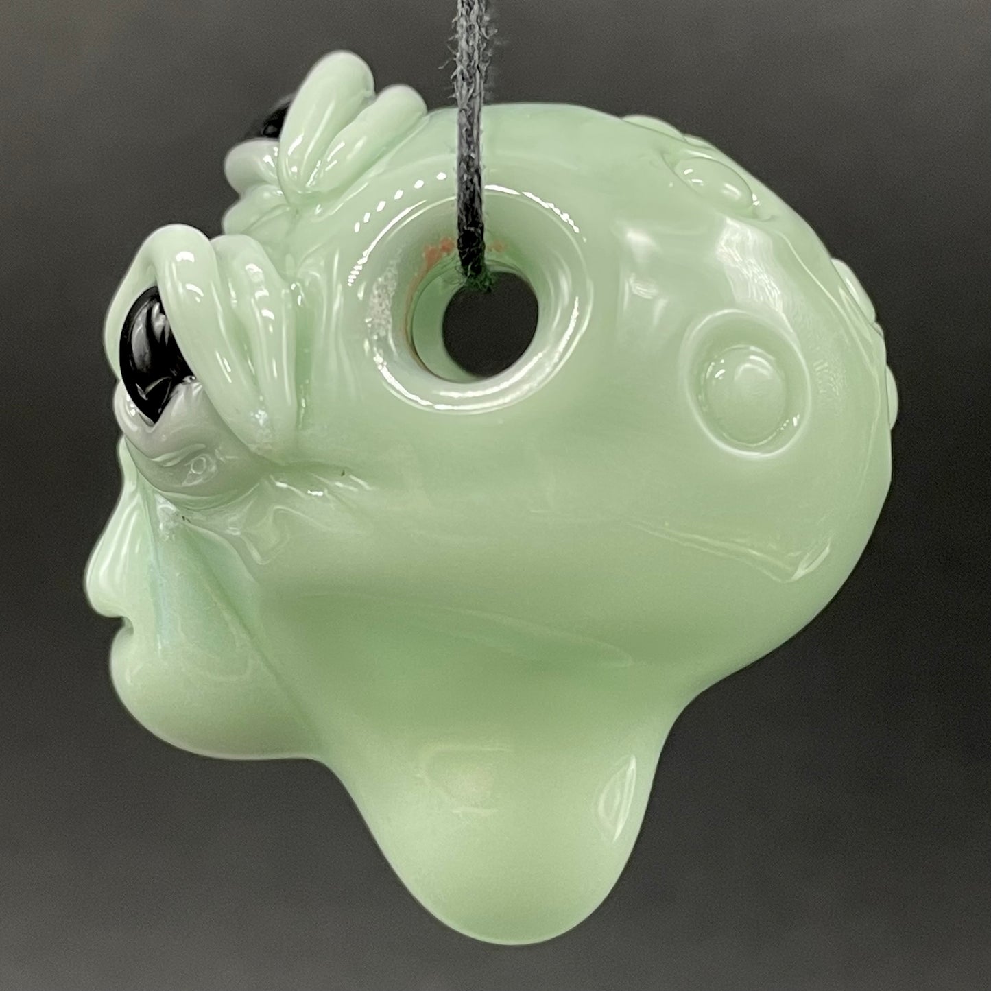 Time manipulating three eye glass alien pendant