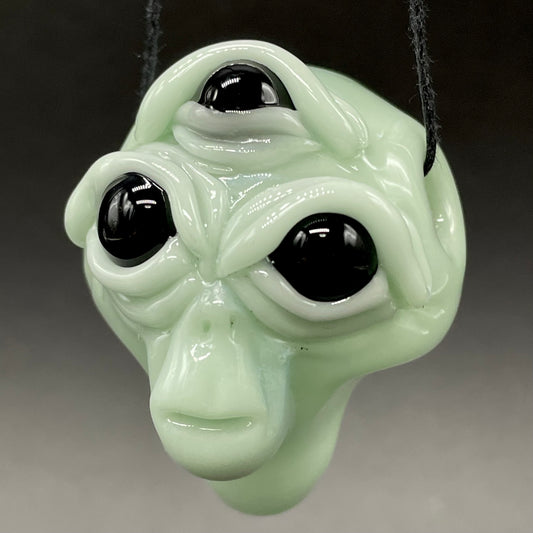 Time manipulating three eye glass alien pendant