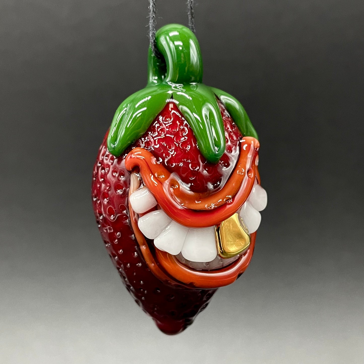 Toothy strawberry pendant