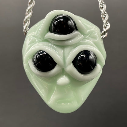 Time manipulating three eye glass alien pendant