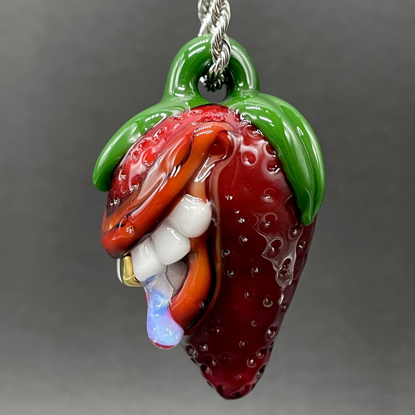Toothy strawberry pendant