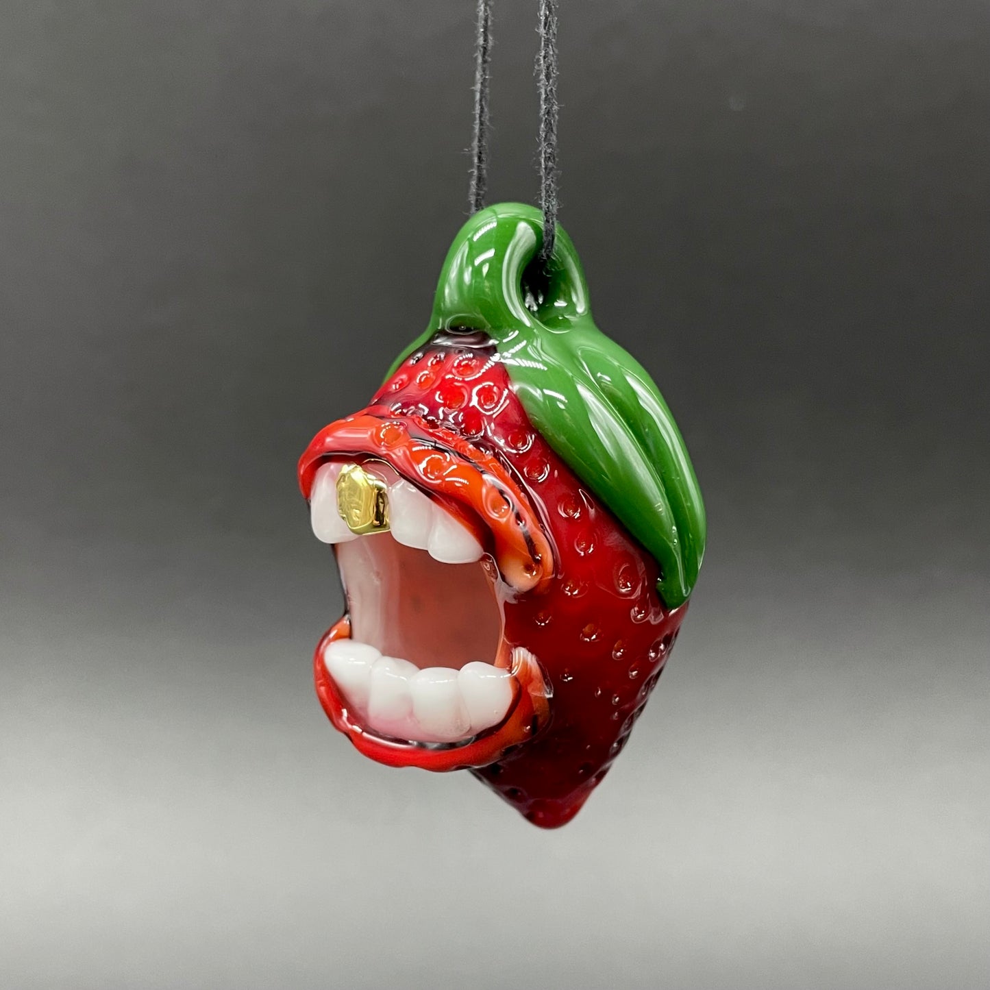 Screaming strawberry glass pendant