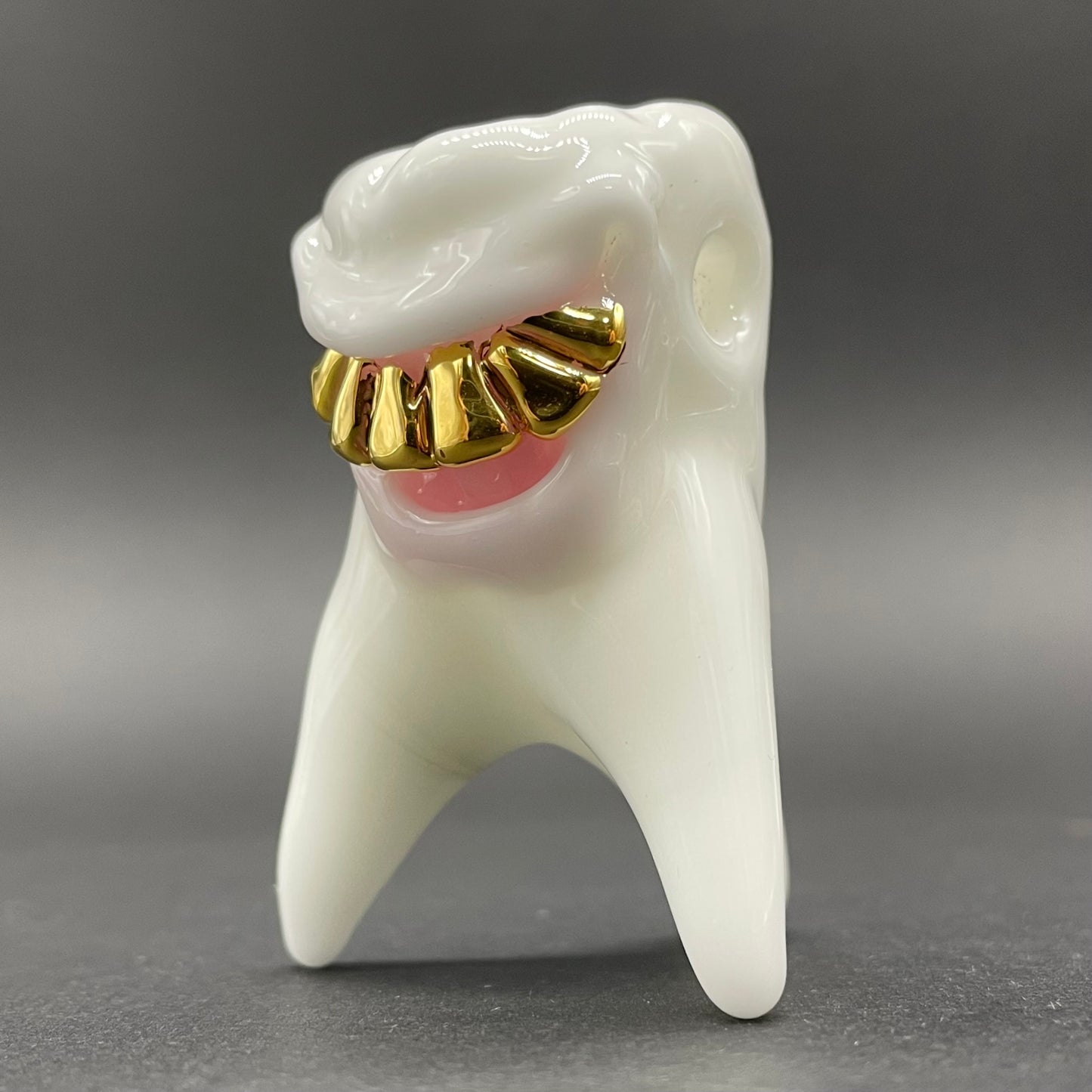 Tooth ache glass pendant