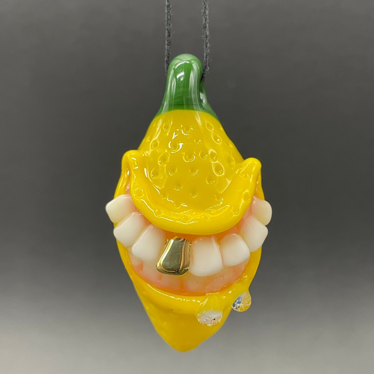 Grinning lemon pendant
