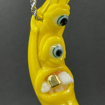 Grinning glass banana pendant