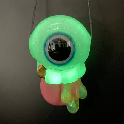 Glow in the dark eye pendant